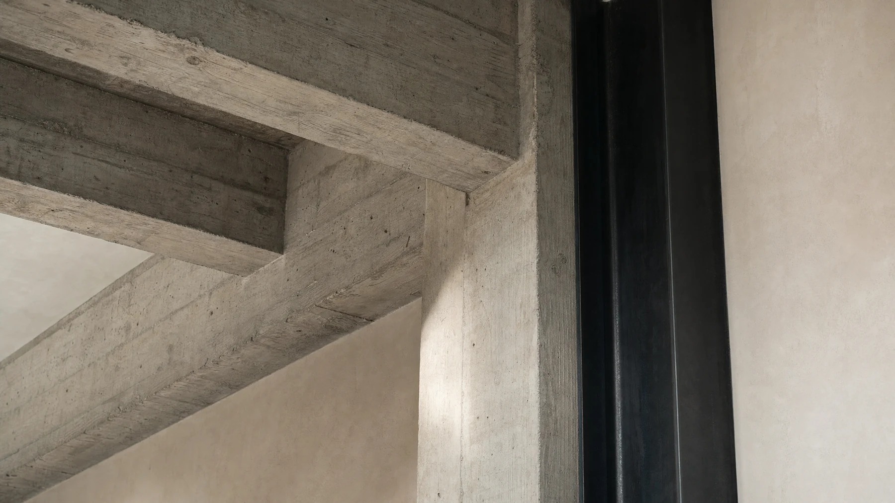 Dining area beneath the loft's original steel windows