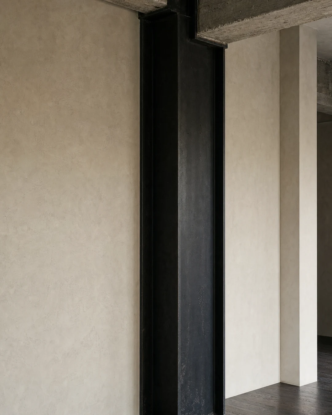 Board-formed concrete and blackened-steel detail